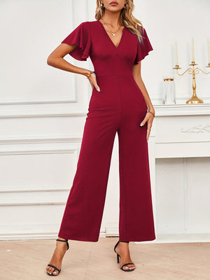 Burgundy flutter sleeve V-neck wide-leg jumpsuit with a fitted waist.