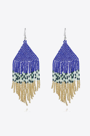 Geometric fringe beaded earrings in royal blue, green, and gold with a boho style.