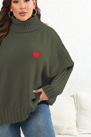Army green knit turtleneck sweater with red heart appliqué and batwing sleeves.