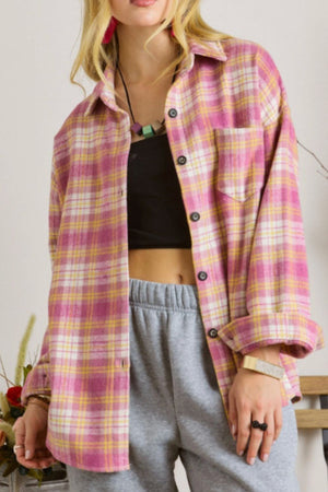 Oversized pink plaid button-down flannel overshirt with a chest pocket.