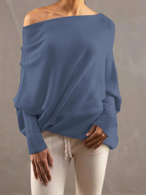 Dusty Blue off-shoulder knit sweater with textured cuffs and batwing sleeves.