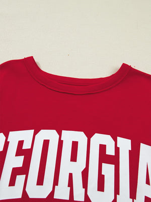 Red cotton blend t-shirt with white bold Georgia lettering, crew neck, drop shoulder.