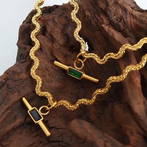 Gold rope chain necklace with emerald and black bar pendants