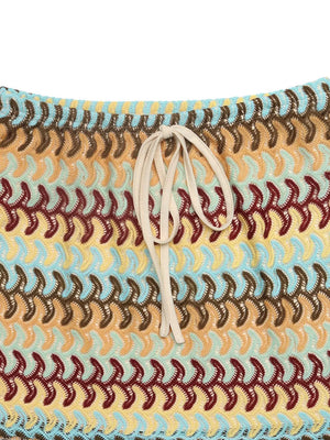 Vibrant crochet mini skirt with a beige drawstring and colorful wavy pattern.