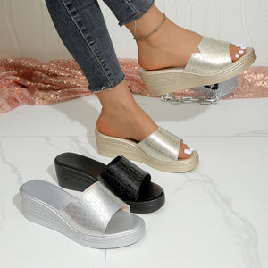 Gold crocodile-embossed open-toe wedge sandals with a comfortable platform sole.
