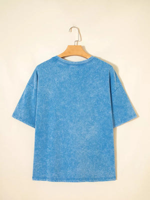 Mineral washed blue cotton crew neck oversized t-shirt with short sleeves.