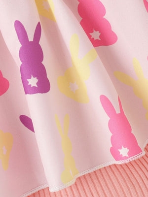 Baby set with pink fabric featuring a whimsical bunny print in purple, pink, and yellow.