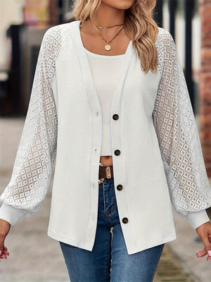 White waffle knit cardigan with lace balloon sleeves and button front.