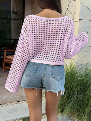 Pink crochet knit boat neck sweater cover-up with open knit detail and long sleeves.