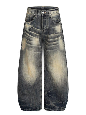 Men's vintage wash wide leg jeans in distressed blue cotton denim.