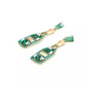 Green champagne bottle drop earrings with clear and green rhinestones.