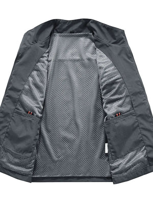 Grey men's utility vest with mesh lining and multiple pockets.