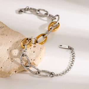Two-tone link bracelet with oval gold and textured silver links, 18K gold-plated stainless steel.