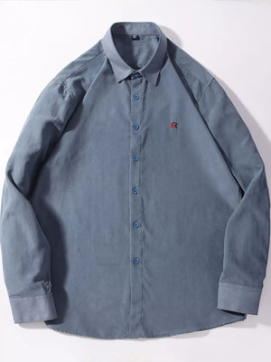 Dusty blue casual button-up shirt with red embroidered logo on chest.