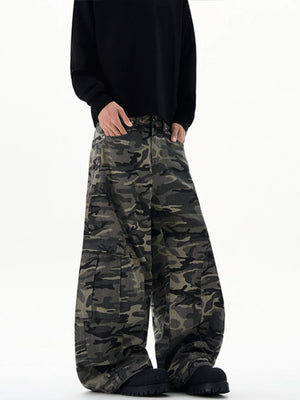 Oversized camouflage cargo sweatpants with multiple pockets and a relaxed fit.