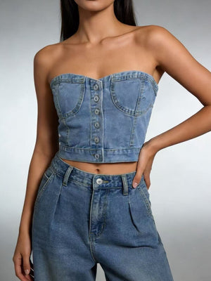 Structured denim tube top with button detail and chest pockets, made of cotton.
