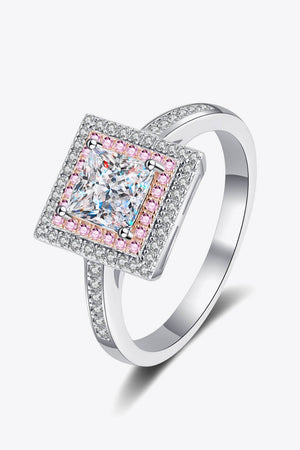 Princess cut halo ring in silver with clear and pink accent stones.
