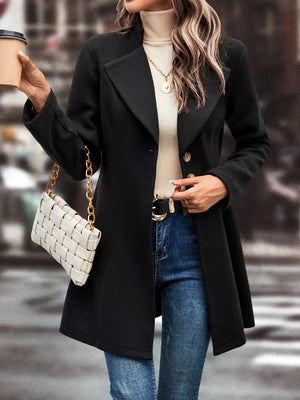 Black wool blend coat with sculpted flare hem, buttoned front, and notched lapels.