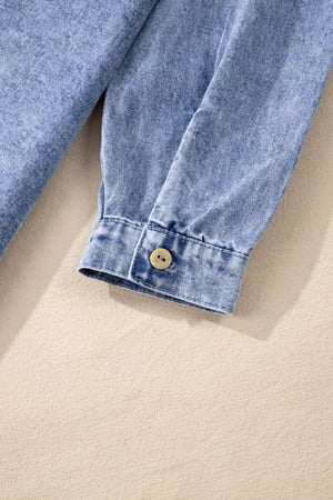 Acid wash denim shirtdress in medium with button cuff detail.