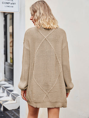 Khaki cable knit longline cardigan with diamond pattern detail on back.
