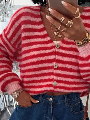 Charming cropped knit cardigan with red and pink stripes, button front, and balloon sleeves.