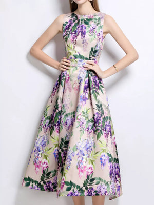 Wisteria floral print midi dress in blush pink with a-line cut and sleeveless design.