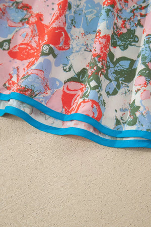 Maxi dress with vibrant floral print, flutter sleeves, and blue trim detail.