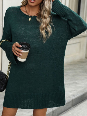 Oversized ribbed knit tunic sweater in Black Forest green with crewneck and long sleeves.