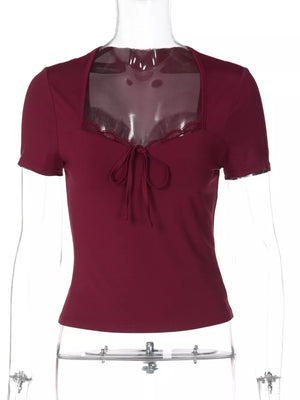 Wine red lace-trimmed tie-front t-shirt with square neckline and short sleeves.