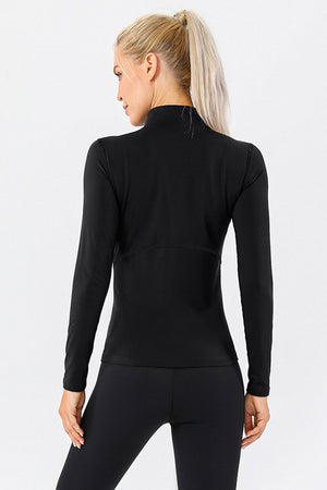 Black athleisure zip-neck top with long sleeves and seam details.