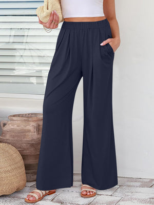 Pleated palazzo trousers in dark blue with pockets and a wide leg
