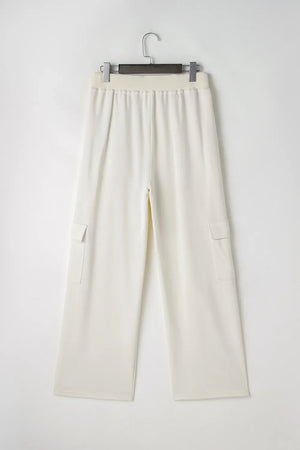 Ivory wide leg cargo pants with elastic waistband and patch pockets.
