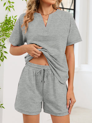 Gray loungewear shorts with drawstring waist and matching v-neck top