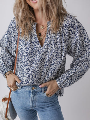 Navy floral print blouse with notched neckline and long sleeves