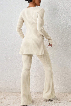 Cream ribbed knit co-ord set with flared pants and side slit tunic.