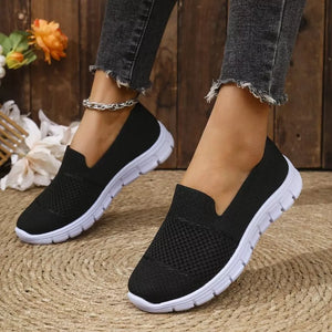 Round Toe Flats Slip-ons in Black, model styling view
