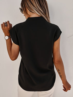 Black short sleeve blouse with V-neck and seamed detail.