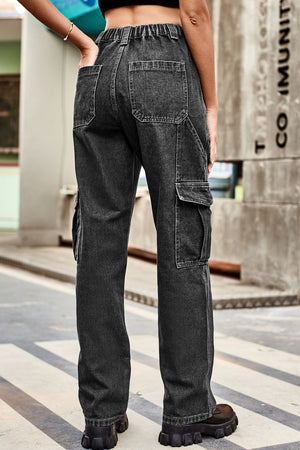 Dark wash denim cargo pants with relaxed fit and elastic waist, featuring multiple pockets.