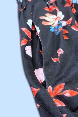 Black floral print sleeveless midi dress with side pocket detail