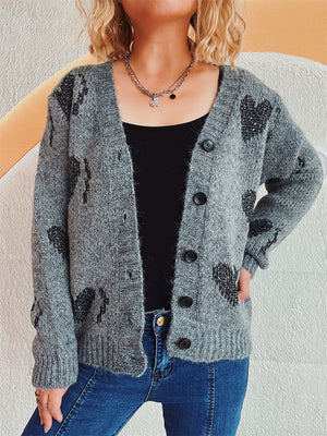 Dark gray acrylic knit cardigan with black heart motif, button front, and V-neck.