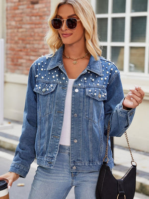 Denim jacket with pearl embellishments and button front.