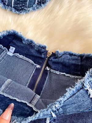 Denim cami and flare set with raw hem detail and zipper closure.