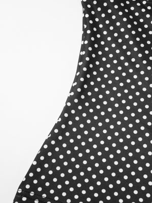 Black polka dot crop top and skirt set with ruffled detail