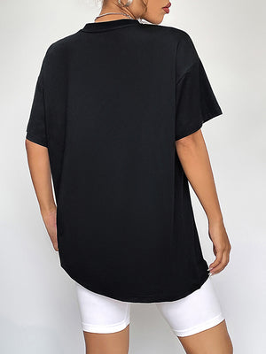 Black oversized t-shirt with short sleeves and a crew neck, shown from the back.