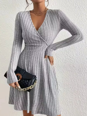 Light gray ribbed wrap mini dress with long sleeves and a V-neckline.