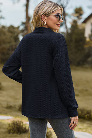 Textured polo-neck sweater in dark blue with button detail and long sleeves.