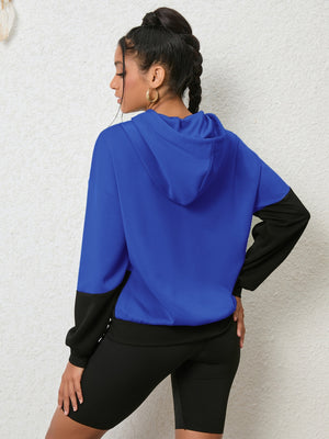 Colorblock royal blue and black hoodie with long sleeves and a hood.