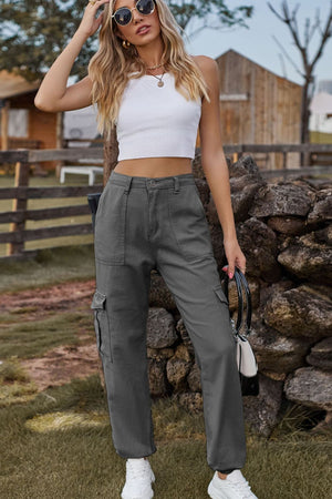 Dark gray utility cargo pants with multiple pockets and a relaxed fit.