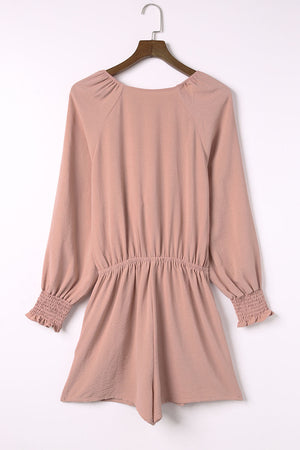 Dusty Pink tie-front blouson sleeve playsuit with smocked cuffs and waist.