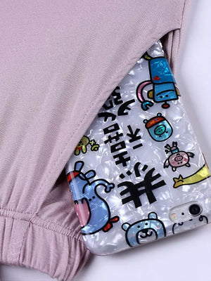 Pajama set in Bean Powder with a phone case featuring cartoon characters and Japanese text.